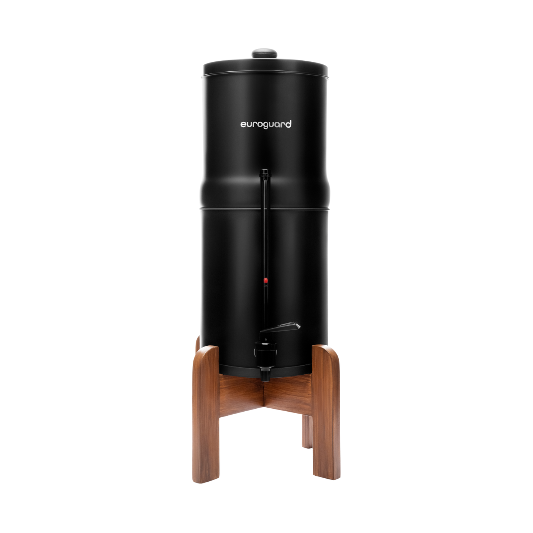 Black water dispenser with wooden stand on a white background